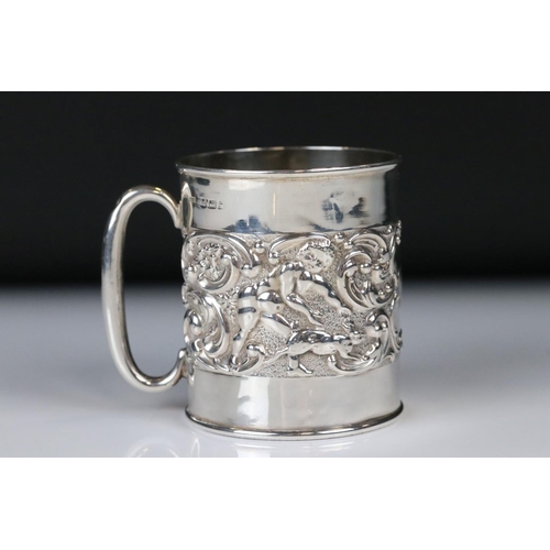 66 - Edwardian Silver Christening Tankard with a band of scrolled repousse decoration featuring cherubs w... 