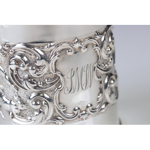 66 - Edwardian Silver Christening Tankard with a band of scrolled repousse decoration featuring cherubs w... 