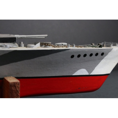 329 - Two painted wooden models of batlteships to include Bismarck and Tirpitz