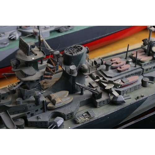 329 - Two painted wooden models of batlteships to include Bismarck and Tirpitz