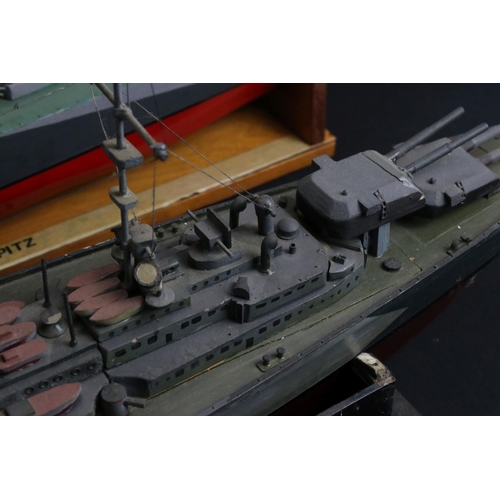 329 - Two painted wooden models of batlteships to include Bismarck and Tirpitz