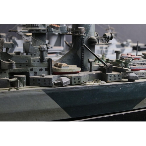 329 - Two painted wooden models of batlteships to include Bismarck and Tirpitz