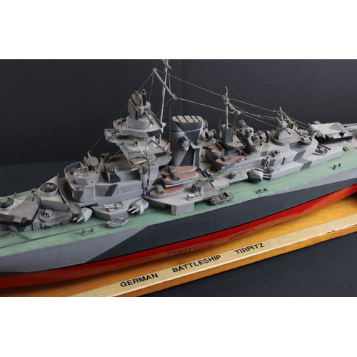 329 - Two painted wooden models of batlteships to include Bismarck and Tirpitz