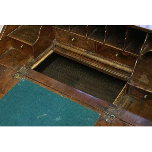 118 - Early 18th century Walnut and Feather Banded Bureau, the fall front opening to a fitted interior wit... 