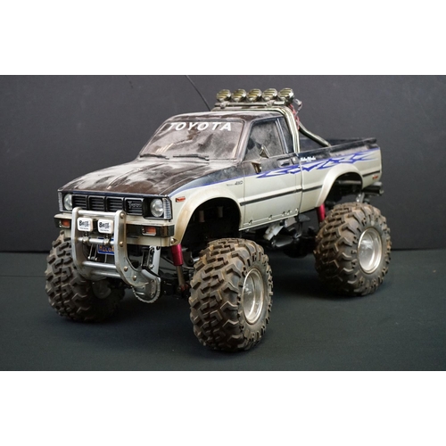 403A - Two Radio Control Cars to include 1 x Tamiya Baja Bug in blue and white, Tamiya Toyota Hilux in blac... 