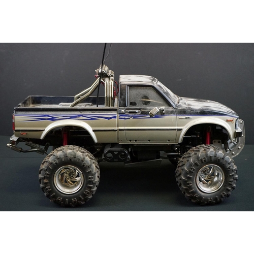 403A - Two Radio Control Cars to include 1 x Tamiya Baja Bug in blue and white, Tamiya Toyota Hilux in blac... 