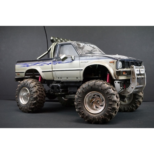 403A - Two Radio Control Cars to include 1 x Tamiya Baja Bug in blue and white, Tamiya Toyota Hilux in blac... 