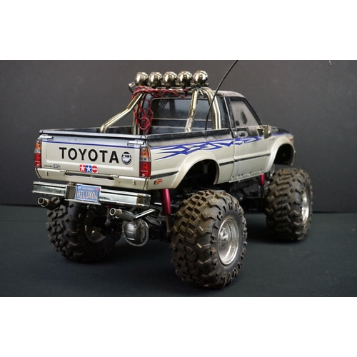 403A - Two Radio Control Cars to include 1 x Tamiya Baja Bug in blue and white, Tamiya Toyota Hilux in blac... 