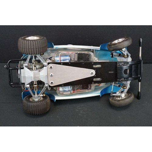 403A - Two Radio Control Cars to include 1 x Tamiya Baja Bug in blue and white, Tamiya Toyota Hilux in blac... 