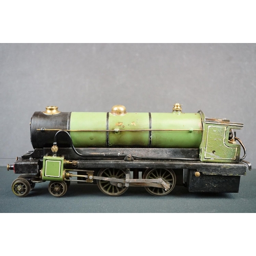 186 - O gauge 4-4-0 steam locomotive painted in green, unmarked, showing some paint wear