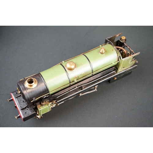 186 - O gauge 4-4-0 steam locomotive painted in green, unmarked, showing some paint wear