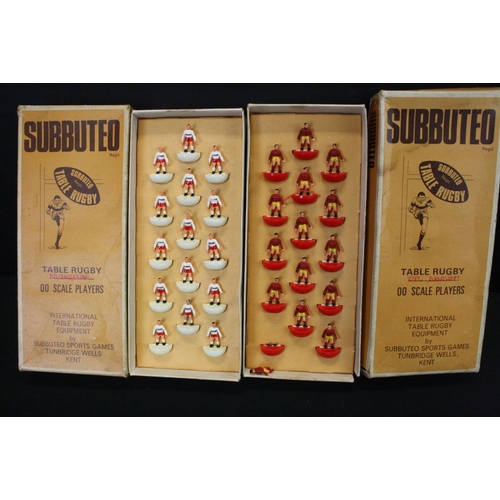 409 - Subbuteo - Eight boxed Rugby teams in a good play worn condition overall, tatty boxes with teams to ... 