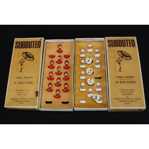 409 - Subbuteo - Eight boxed Rugby teams in a good play worn condition overall, tatty boxes with teams to ... 