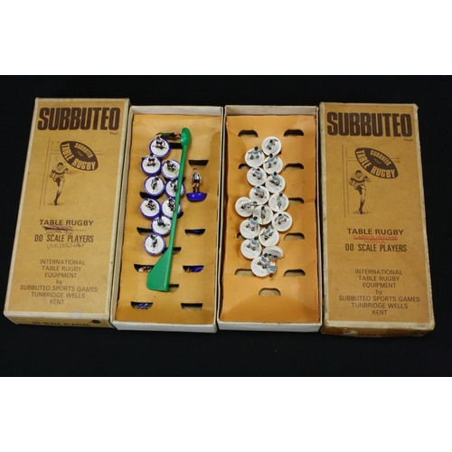 409 - Subbuteo - Eight boxed Rugby teams in a good play worn condition overall, tatty boxes with teams to ... 