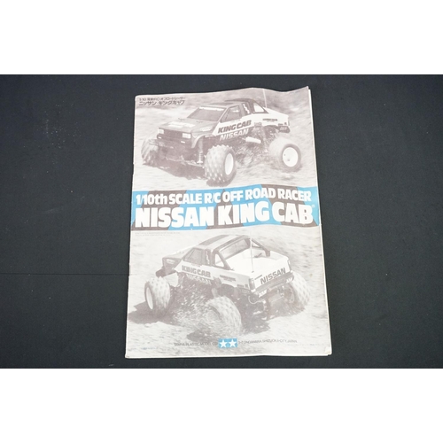 396 - Tamiya 1/10 R/C Nissan King Cab off road racer radio control car, with instructions