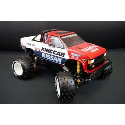 396 - Tamiya 1/10 R/C Nissan King Cab off road racer radio control car, with instructions