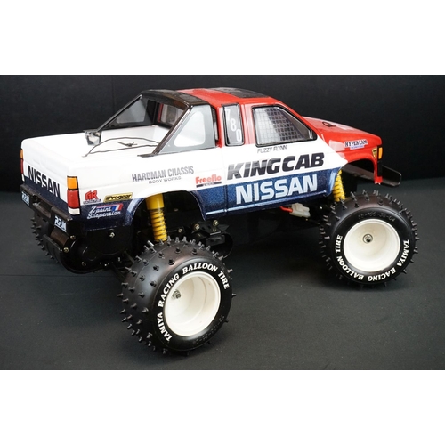 396 - Tamiya 1/10 R/C Nissan King Cab off road racer radio control car, with instructions