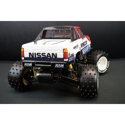 396 - Tamiya 1/10 R/C Nissan King Cab off road racer radio control car, with instructions