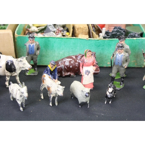 448 - Collection of mid 20th C Britains farming related figures to include various animals, farmers and ac... 