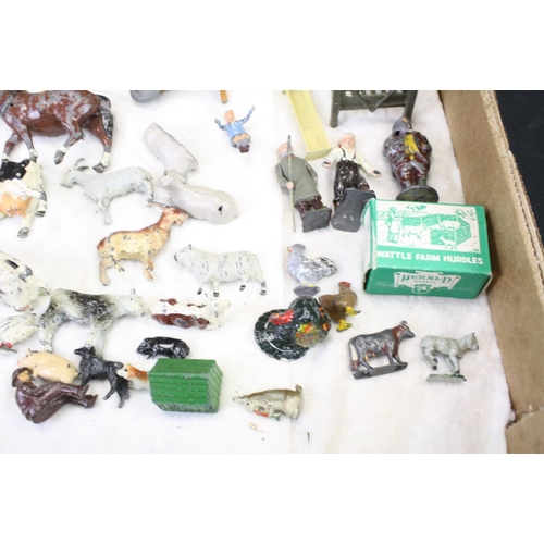 459 - Over 40 Mid 20th C metal farm animals, figures and accessories, mainly Britains, also featuring Timp... 