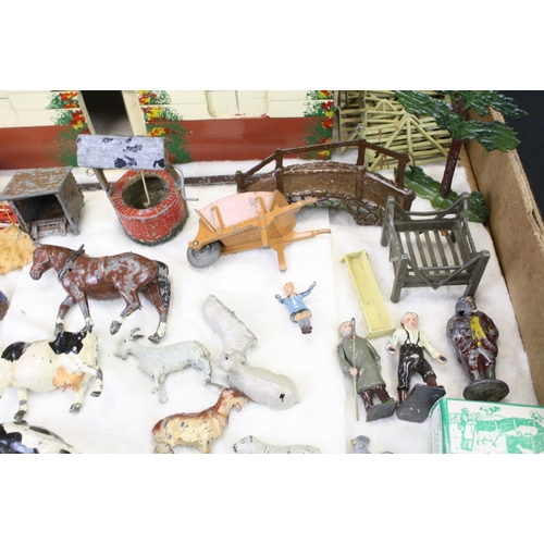 459 - Over 40 Mid 20th C metal farm animals, figures and accessories, mainly Britains, also featuring Timp... 