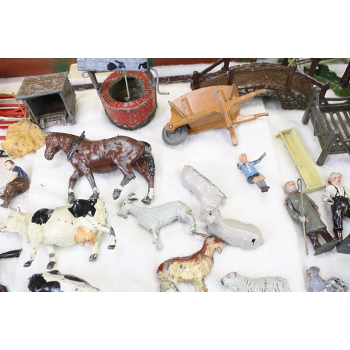 459 - Over 40 Mid 20th C metal farm animals, figures and accessories, mainly Britains, also featuring Timp... 