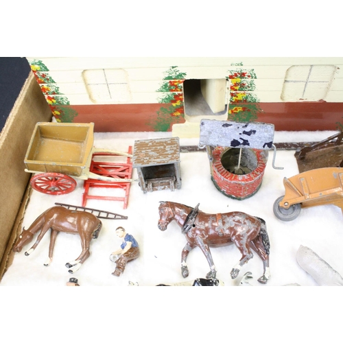 459 - Over 40 Mid 20th C metal farm animals, figures and accessories, mainly Britains, also featuring Timp... 