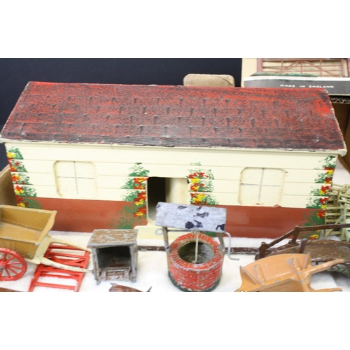 459 - Over 40 Mid 20th C metal farm animals, figures and accessories, mainly Britains, also featuring Timp... 