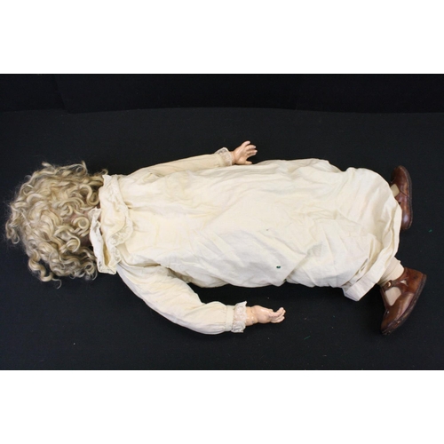 475 - A Kammer & Reinhardt, Simon & Halbig bisque head doll with sleeping brown eyes, composition body dre... 