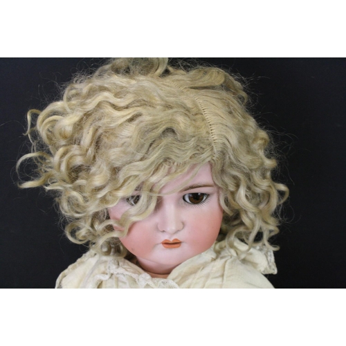 475 - A Kammer & Reinhardt, Simon & Halbig bisque head doll with sleeping brown eyes, composition body dre... 