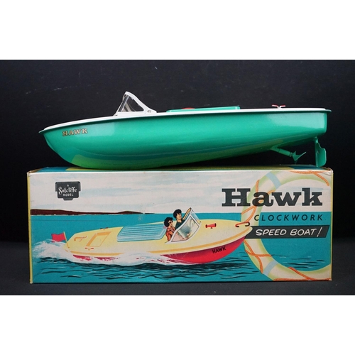 432 - Three boxed Sutcliffe clockwork metal boats to include Hawk in light green & white, Tiger Speed Boat... 