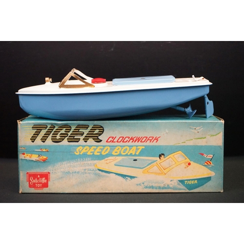 432 - Three boxed Sutcliffe clockwork metal boats to include Hawk in light green & white, Tiger Speed Boat... 