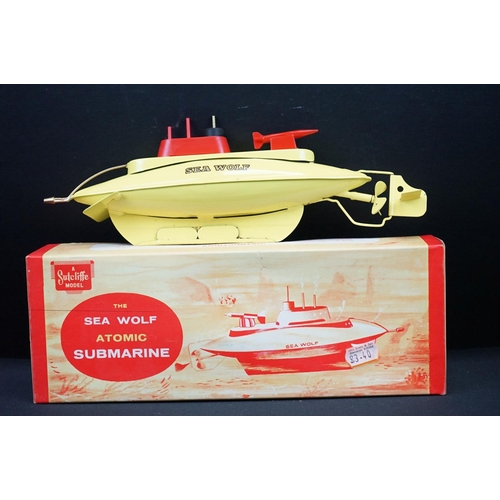 432 - Three boxed Sutcliffe clockwork metal boats to include Hawk in light green & white, Tiger Speed Boat... 