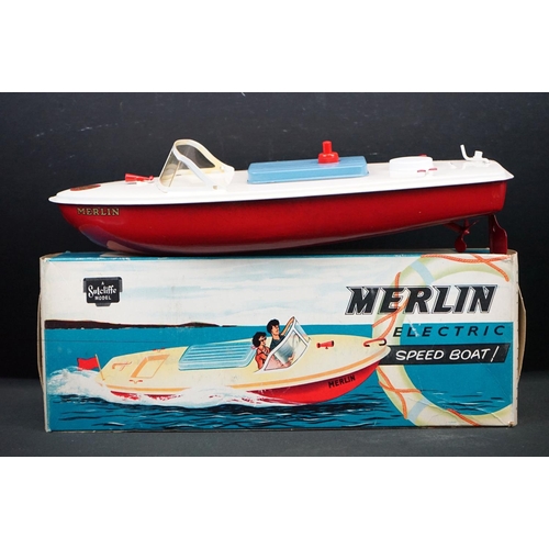 433 - Three boxed Sutcliffe metal boats to include Jupiter in red & white, Merlin electric Speed Boat in r... 