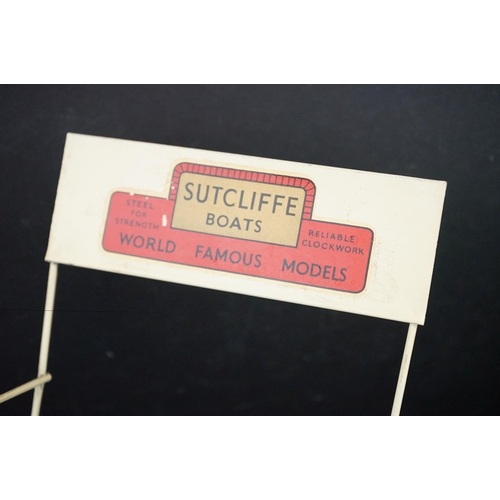 435 - Sutcliffe Boats shop display stand plus a boxed Sutcliffe Victor clockwork motor torpedo boat (tatty... 