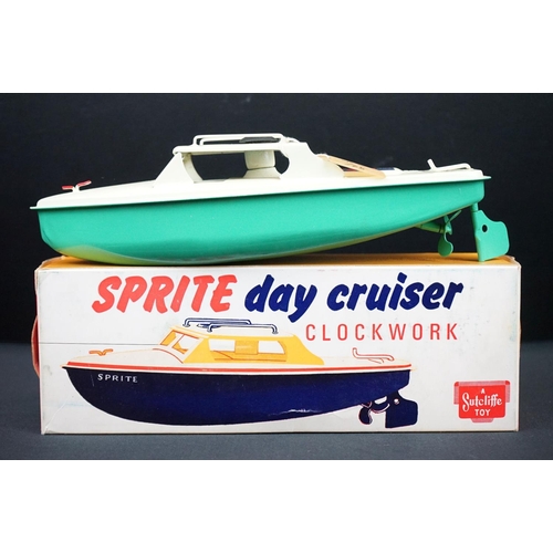 439 - Three boxed Sutcliffe clockwork metal boats to include Jupiter Ocean Pilot Cruiser in red & white, S... 