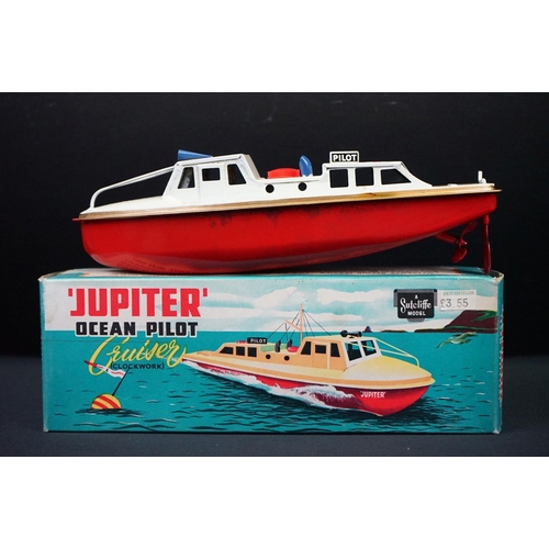 439 - Three boxed Sutcliffe clockwork metal boats to include Jupiter Ocean Pilot Cruiser in red & white, S... 