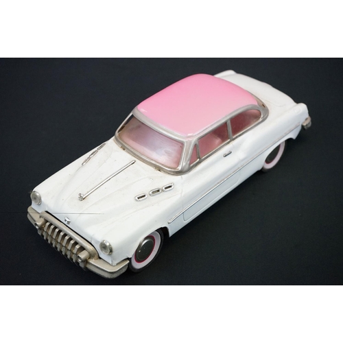 440 - Two boxed tinplate Luxe Car Heavy Gauge Sedan models, one cream with pink roof, the other blue