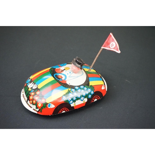 443 - Three tinplate model vehicles, to include Daiya battery operated Porsche & 2 x GDR made dodgem cars ... 