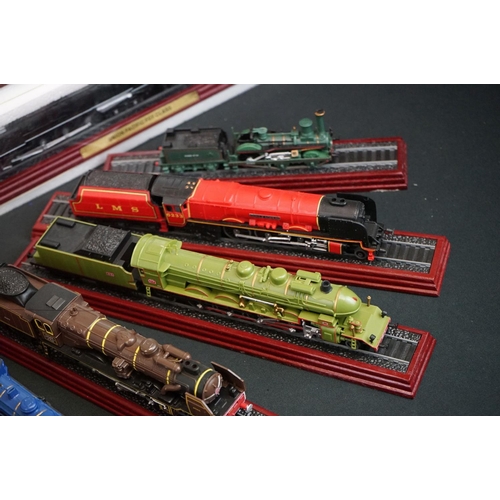 1263 - Approx. 36 collectors locomotives on plinths, mostly steam locos with tenders, many in polystyrene c... 