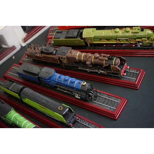 1263 - Approx. 36 collectors locomotives on plinths, mostly steam locos with tenders, many in polystyrene c... 