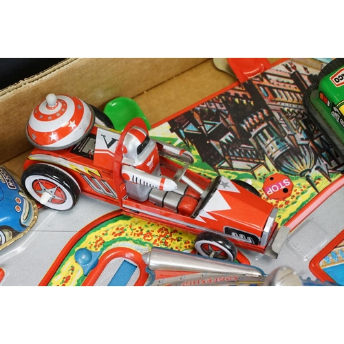 503 - Collection of tinplate toys, to include roadway with vehicles, fairground spaceship ride, various ca... 