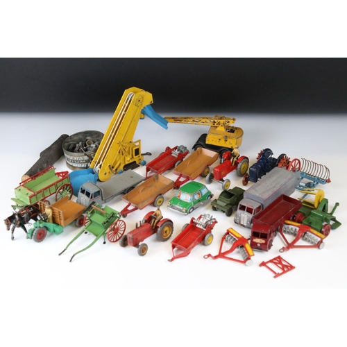 1377 - Around 20 play worn mid 20th C diecast models to include Dinky and Britains, mainly featuring farmin... 