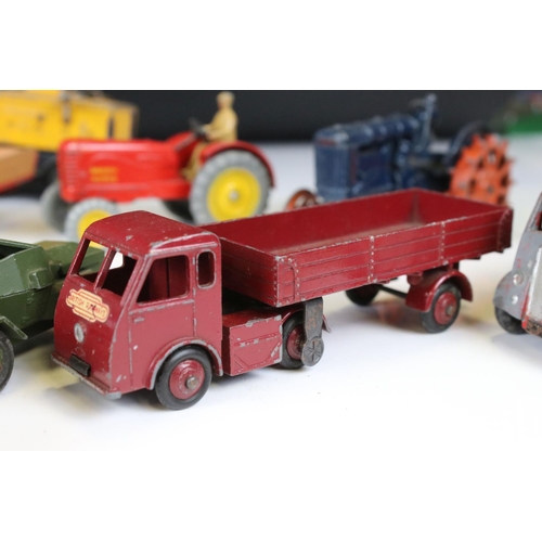 1377 - Around 20 play worn mid 20th C diecast models to include Dinky and Britains, mainly featuring farmin... 