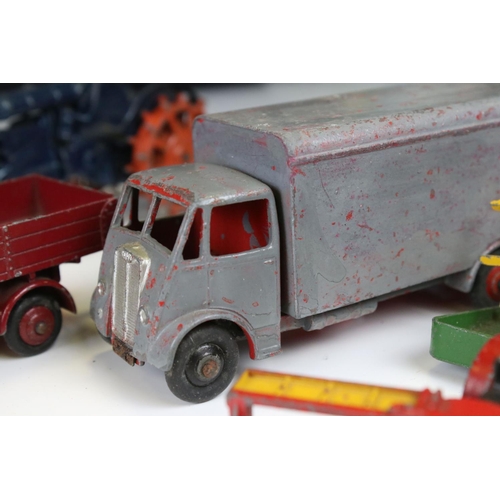 1377 - Around 20 play worn mid 20th C diecast models to include Dinky and Britains, mainly featuring farmin... 