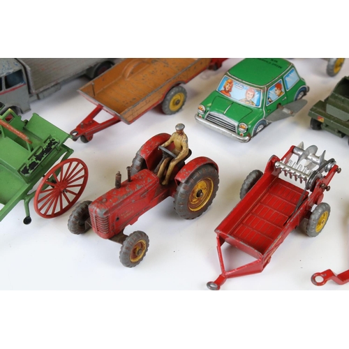 1377 - Around 20 play worn mid 20th C diecast models to include Dinky and Britains, mainly featuring farmin... 