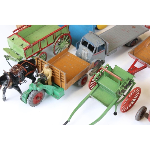 1377 - Around 20 play worn mid 20th C diecast models to include Dinky and Britains, mainly featuring farmin... 