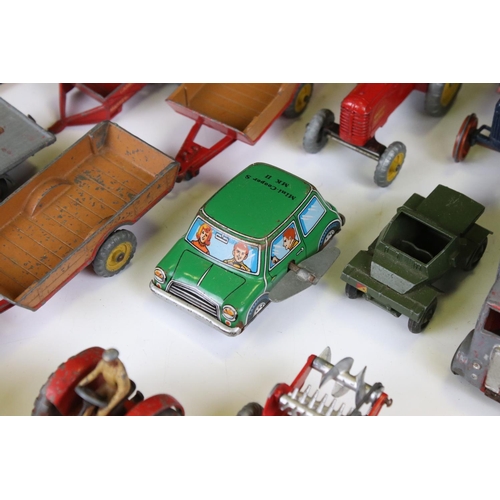 1377 - Around 20 play worn mid 20th C diecast models to include Dinky and Britains, mainly featuring farmin... 