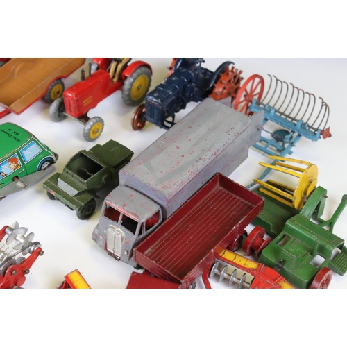 1377 - Around 20 play worn mid 20th C diecast models to include Dinky and Britains, mainly featuring farmin... 