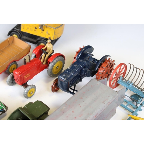 1377 - Around 20 play worn mid 20th C diecast models to include Dinky and Britains, mainly featuring farmin... 